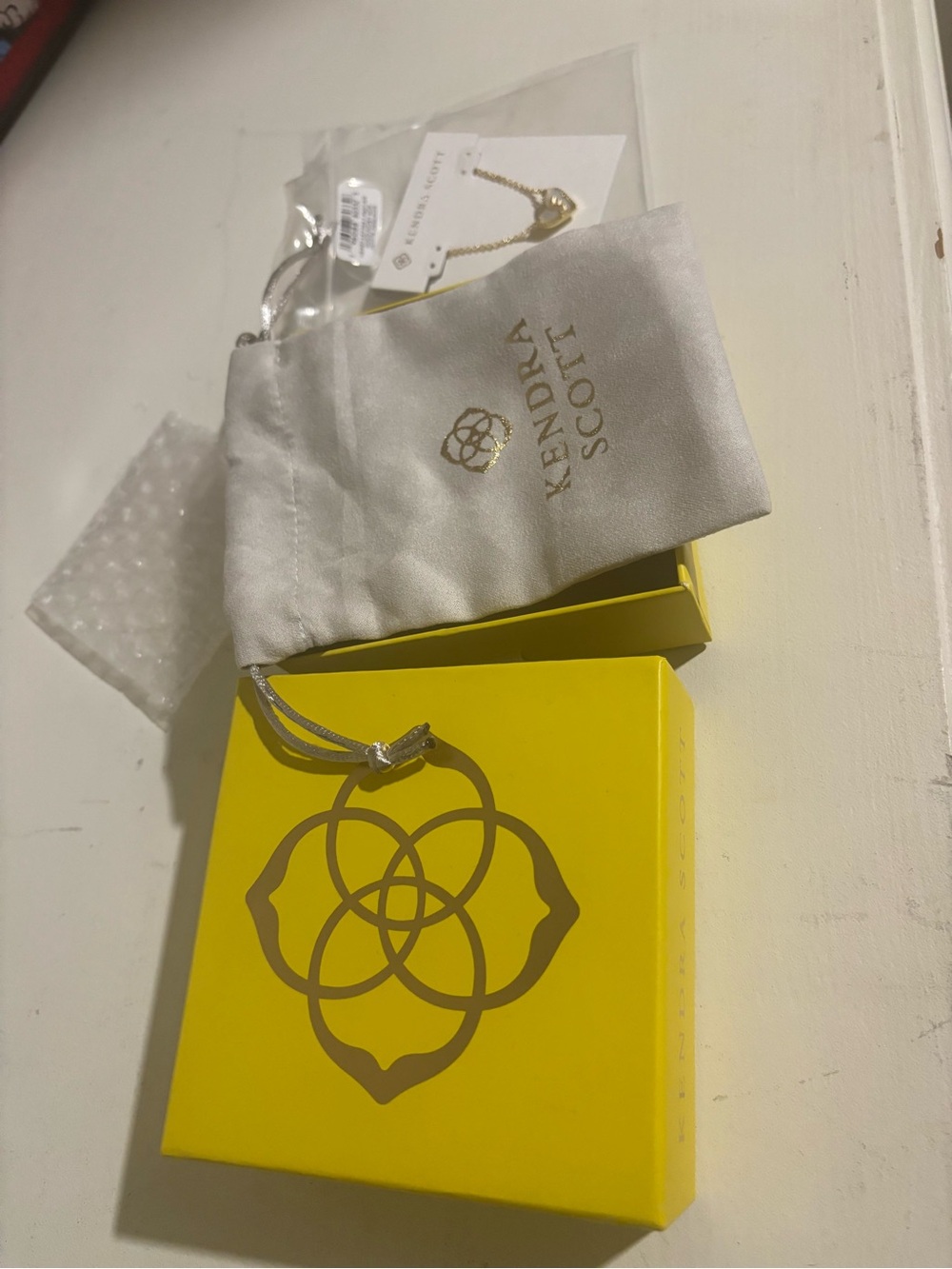 Kendra Scott Cream Drawstring Jewelry Pouch with Gold Logo